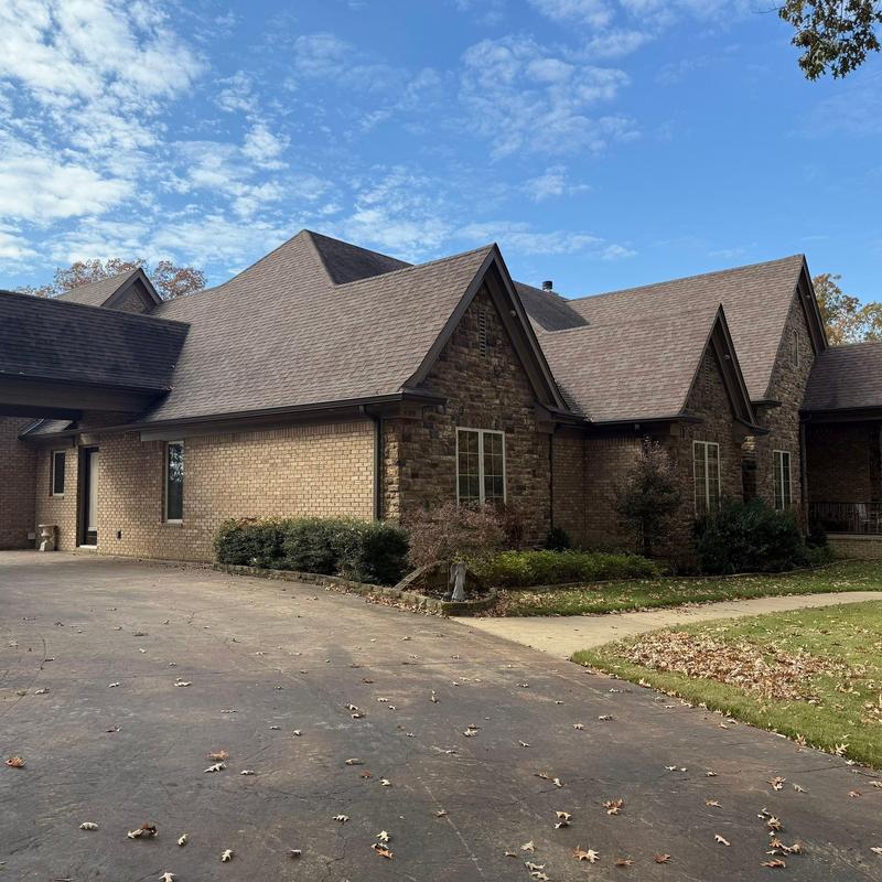 Asphalt shingle roof with hail damage inspection