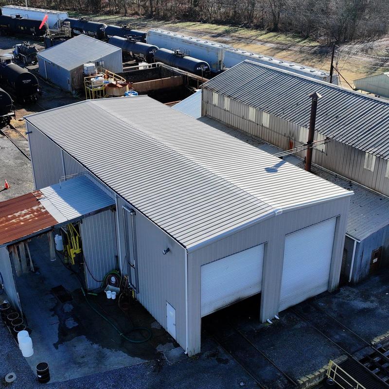 Metal commercial roof with hail damage inspection