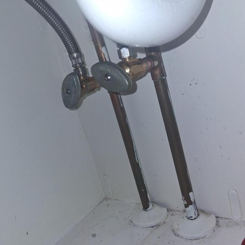 Stop valves on copper water pipes under sink