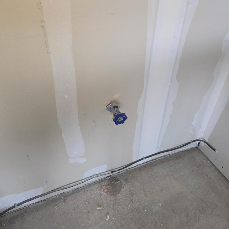 Frost free silcock valve installed on garage wall