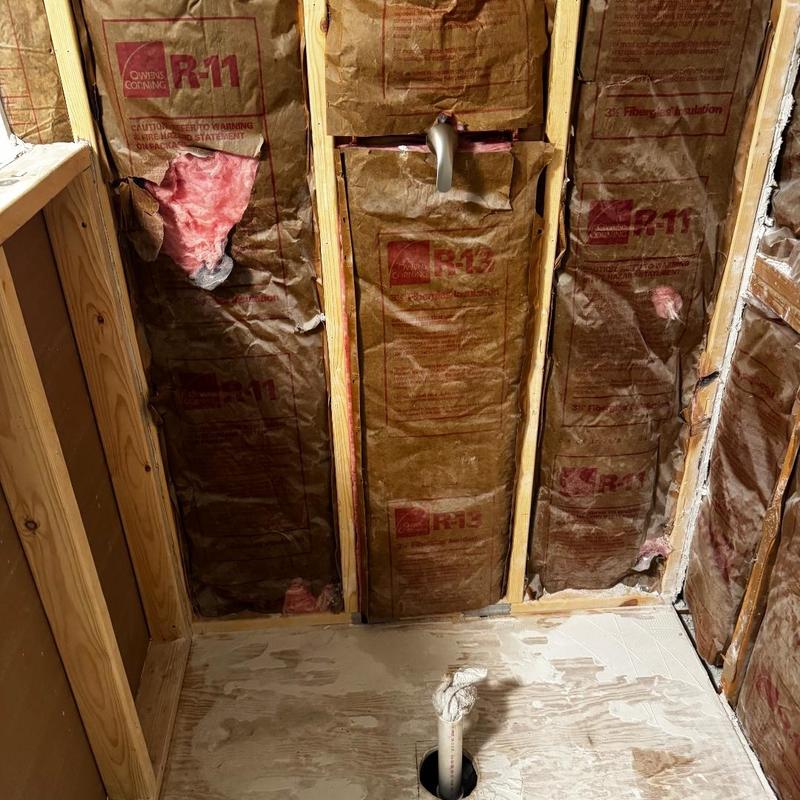 Shower valve and new drain pipe installation in wall cavity