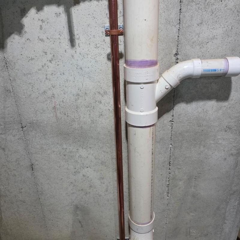1-inch copper water service pipe with PVC vent stack