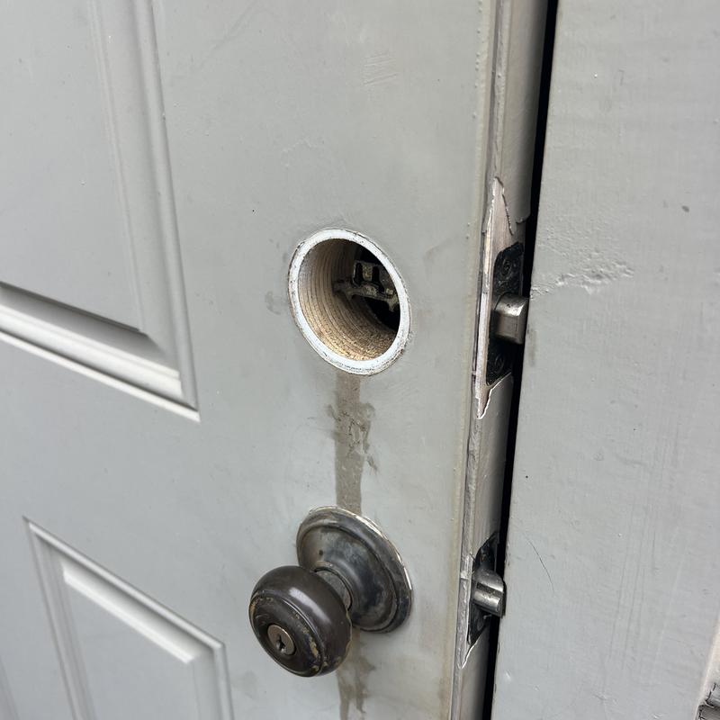 Door lock housing with missing deadbolt lock mechanism