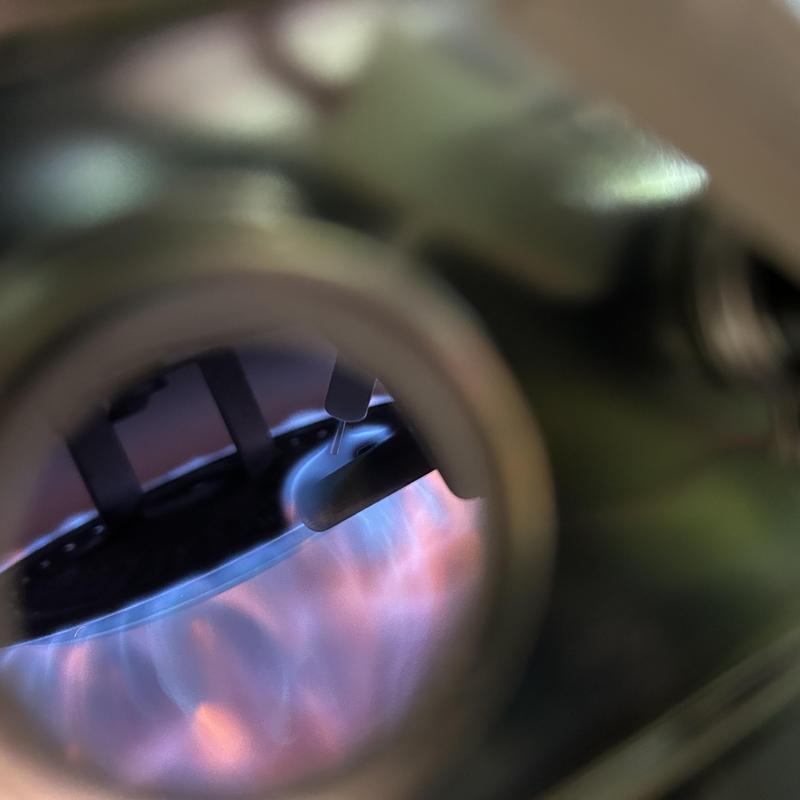 Water heater burner flame inside close-up view