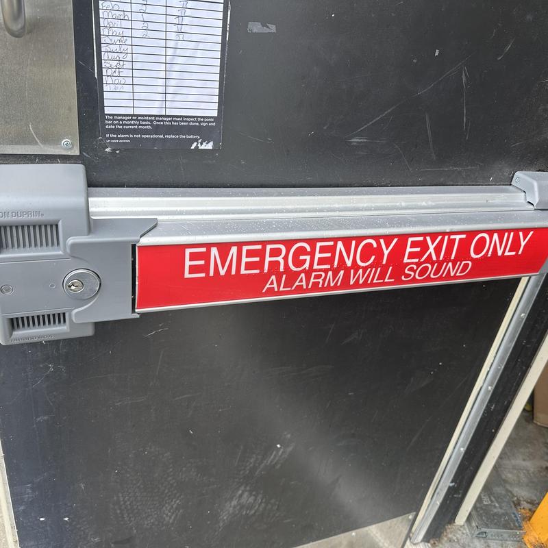 Exit device with keyed lock cylinder on emergency door Exit device with keyed lock cylinder on emergency door
