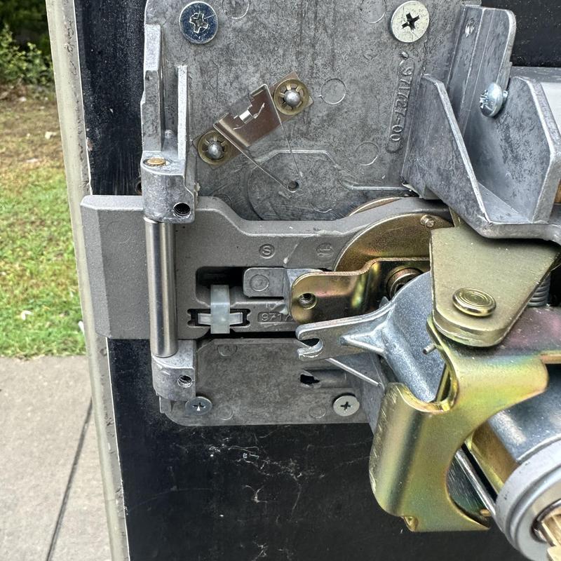 Exit device lock cylinder and bolts installation close-up Exit device lock cylinder and bolts installation close-up