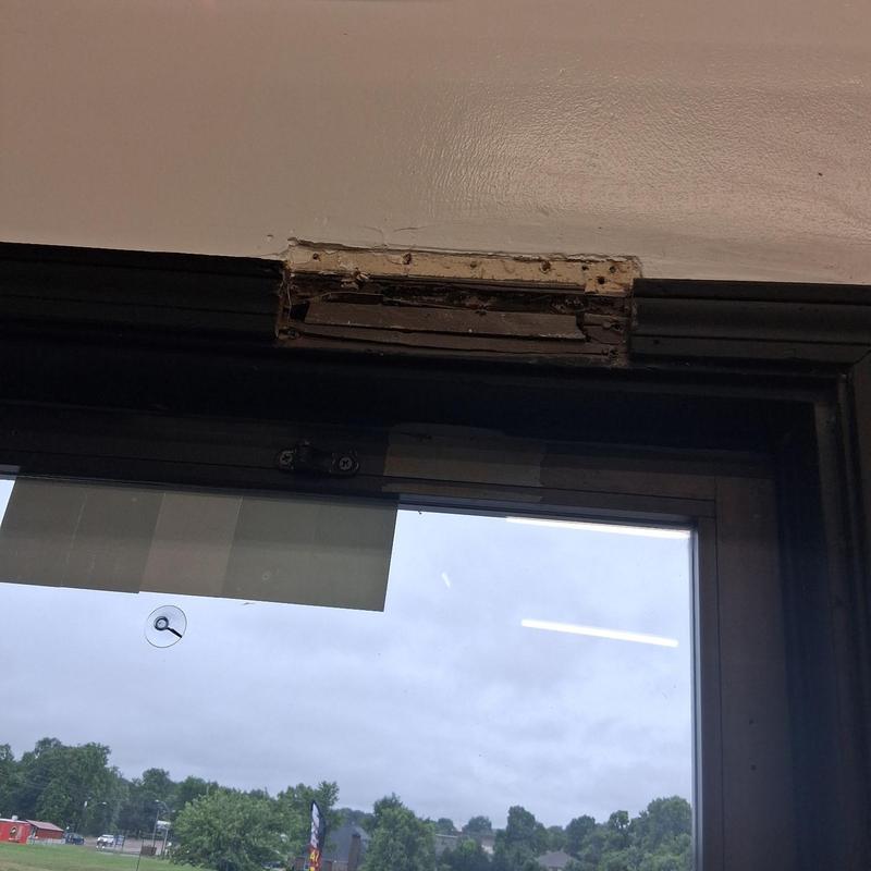 Door closer mounting bracket damaged above door frame