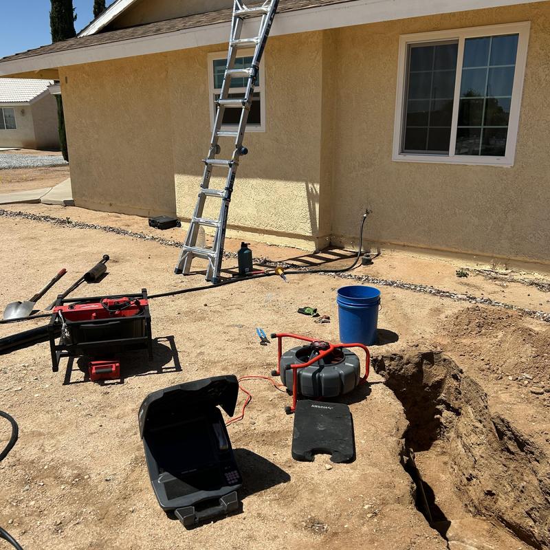 Septic tank drain line excavation and inspection setup