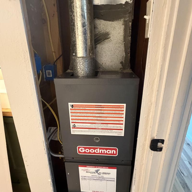 Goodman furnace in bathroom closet with vent pipe Goodman furnace in bathroom closet with vent pipe