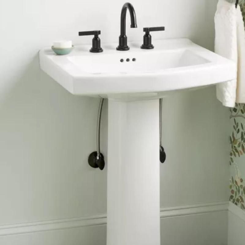 Pedestal sink with black faucet and handles installation Pedestal sink with black faucet and handles installation