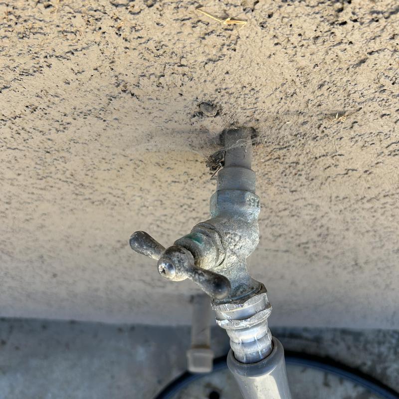 Outdoor hose bib with attached garden hose connector