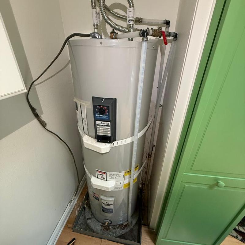 Electric water heater new installation and plumbing connections