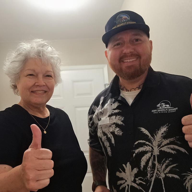 Toilet blockage cleared with thumbs up from plumber and client