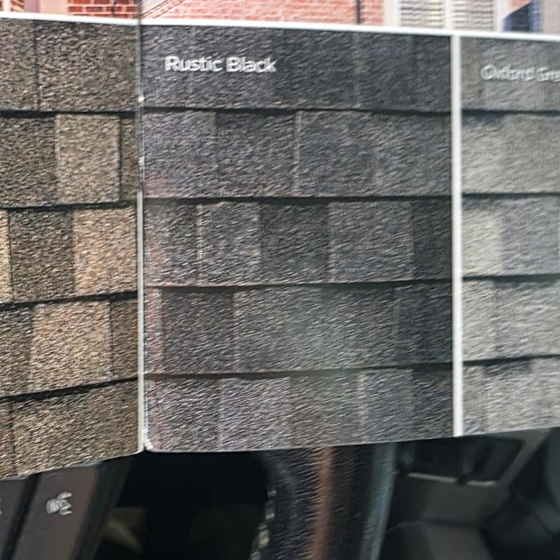 Roof shingles color sample board showing Rustic Black option