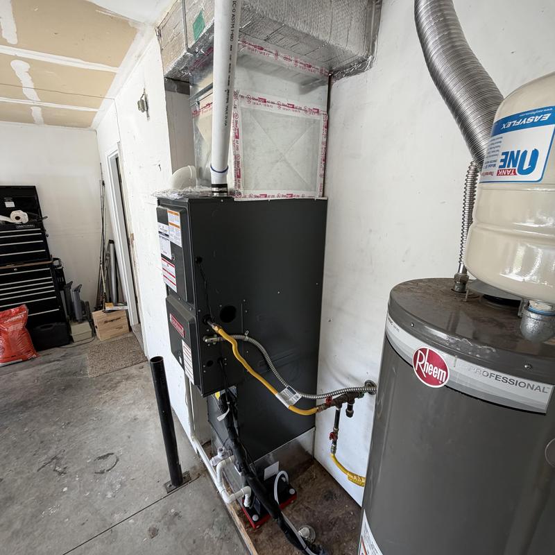 Furnace and water heater venting installation in garage