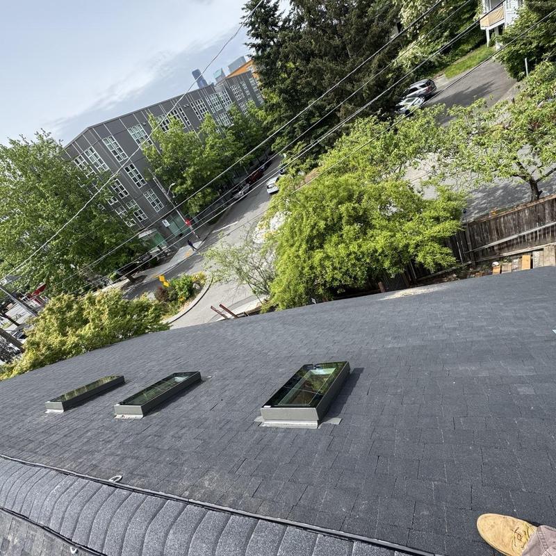 Shingle roof with skylights installation in Seattle