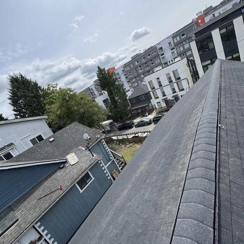 Shingle roof replacement with ridge caps in Seattle