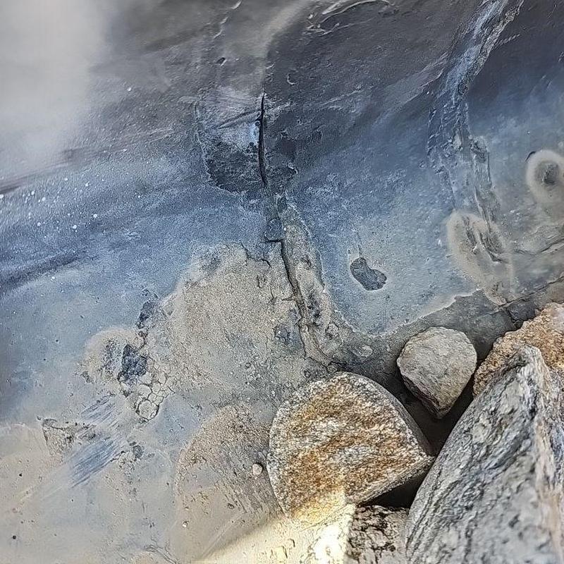 Ballast system membrane cracks near roofing stones
