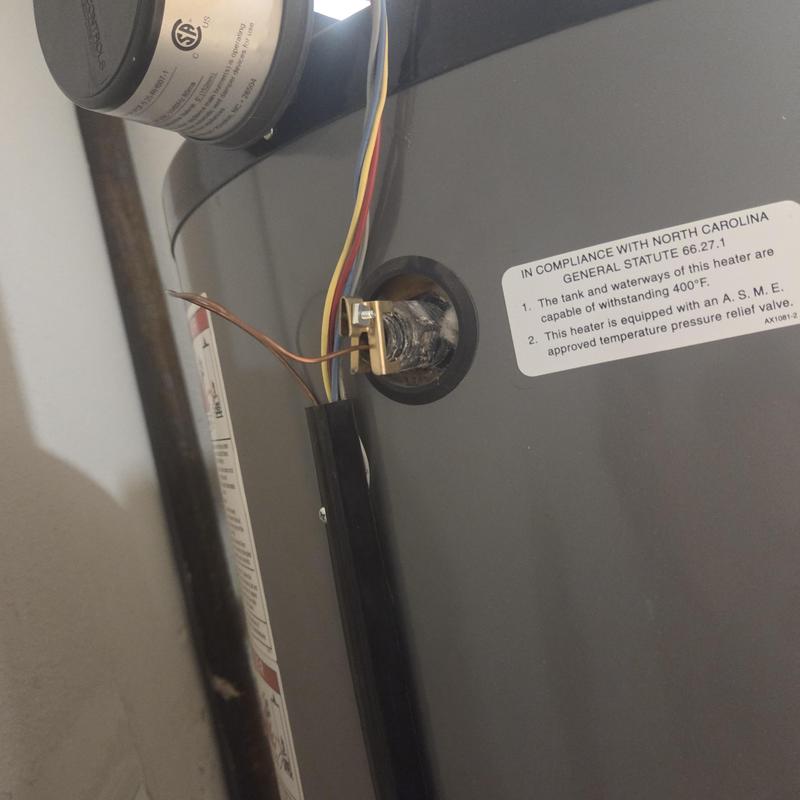 Aquastat sensor on boiler with wiring exposed Aquastat sensor on boiler with wiring exposed