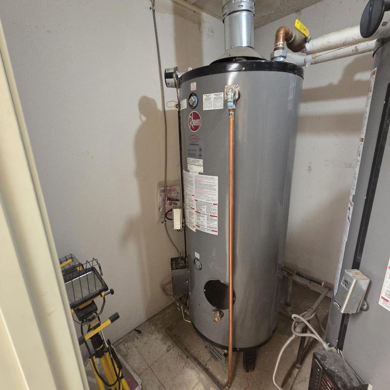 Water heater with copper pipe and vent pipe installed Water heater with copper pipe and vent pipe installed