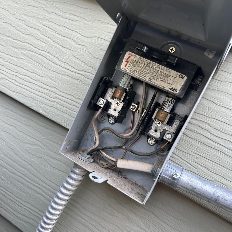 Electrical fuse box with exposed wiring and conduit Electrical fuse box with exposed wiring and conduit