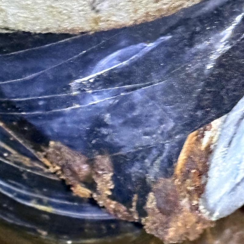 Sewer pipe interior showing rust and corrosion damage Sewer pipe interior showing rust and corrosion damage