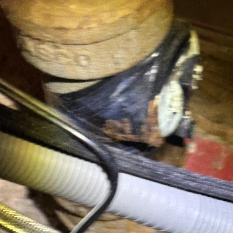 Water meter and pipe with wiring in basement Water meter and pipe with wiring in basement