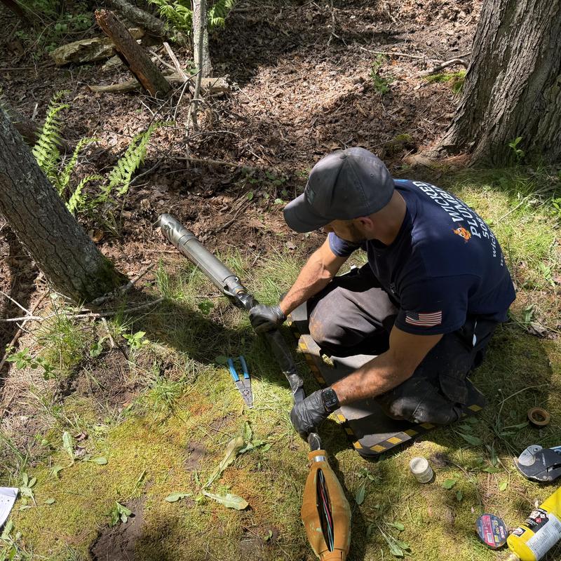 Well pump replacement installation in wooded area