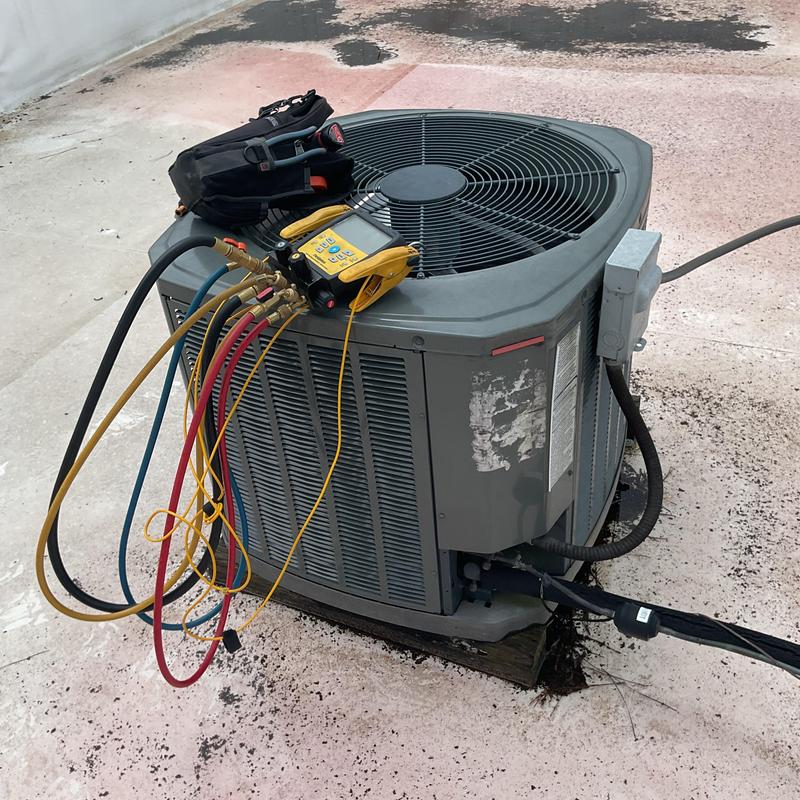 Air conditioner condenser with diagnostic gauges attached Air conditioner condenser with diagnostic gauges attached