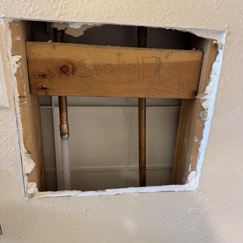 Copper piping replacement with new PEX lines in wall cavity