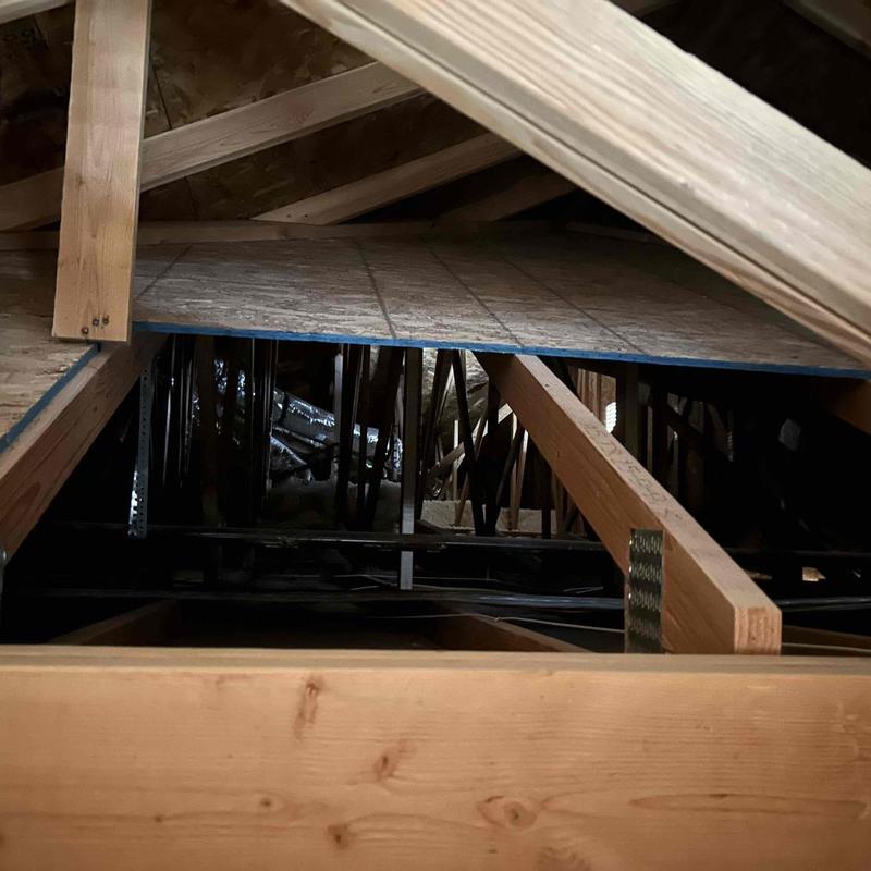 Attic electrical wiring and wooden roof framing beams Attic electrical wiring and wooden roof framing beams