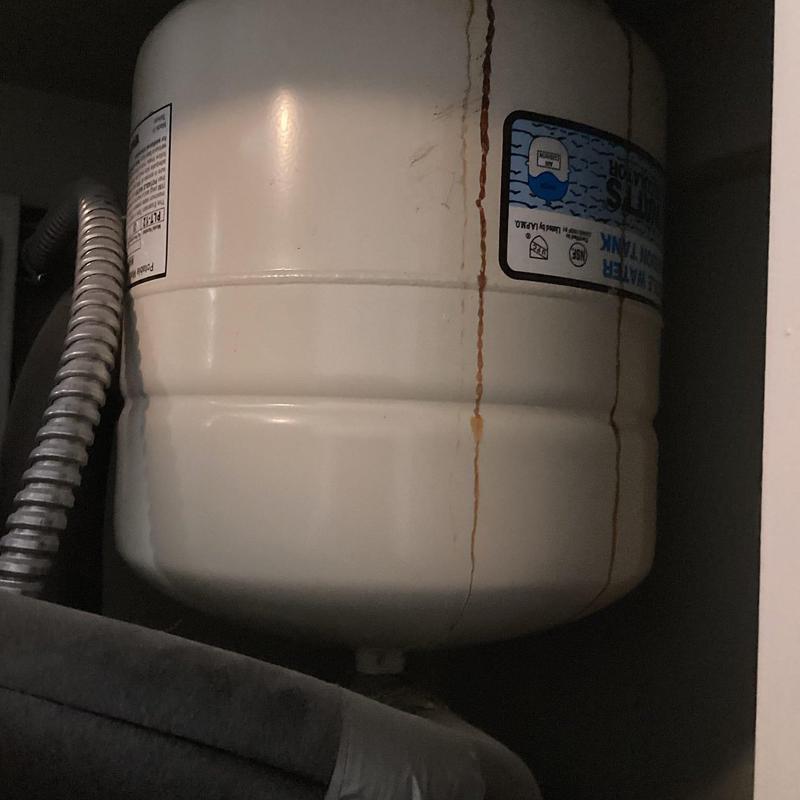 Thermal expansion tank with rust and leak stains Thermal expansion tank with rust and leak stains