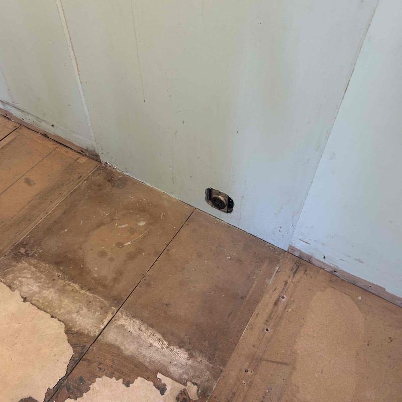 Electrical outlet box installation on wall with bare floor Electrical outlet box installation on wall with bare floor