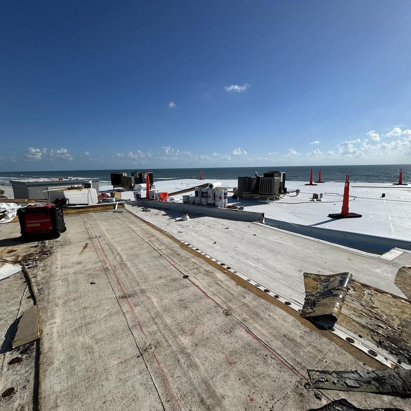 TPO commercial roof removal and replacement in progress TPO commercial roof removal and replacement in progress
