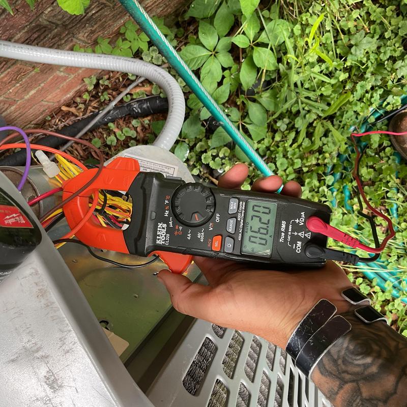Electrical connections testing on HVAC unit with meter Electrical connections testing on HVAC unit with meter