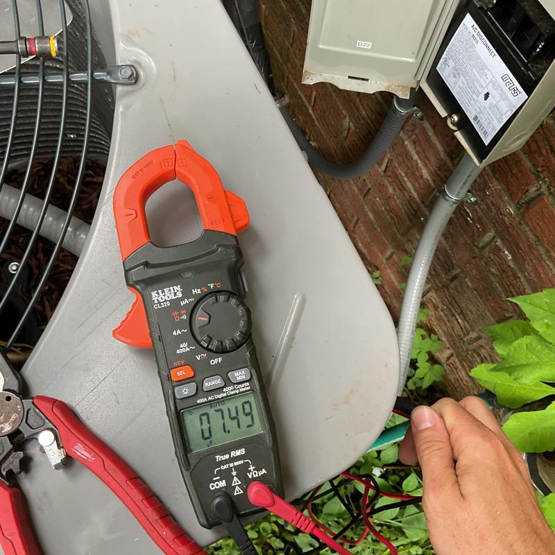 Clamp meter on HVAC condenser electrical system Clamp meter on HVAC condenser electrical system