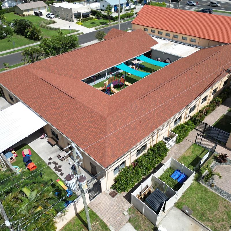Owens Corning Terra Cotta shingle roof on commercial building Owens Corning Terra Cotta shingle roof on commercial building