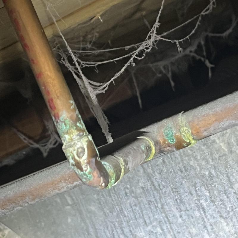 Copper water pipes with corrosion in crawl space Copper water pipes with corrosion in crawl space