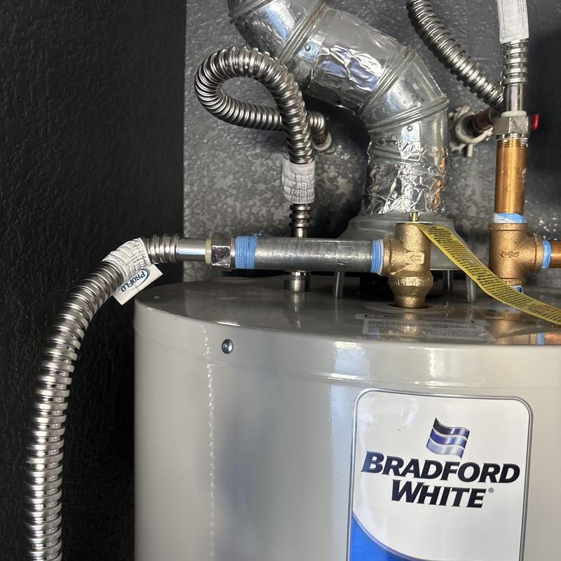 Water heater T&P relief valve and piping connections