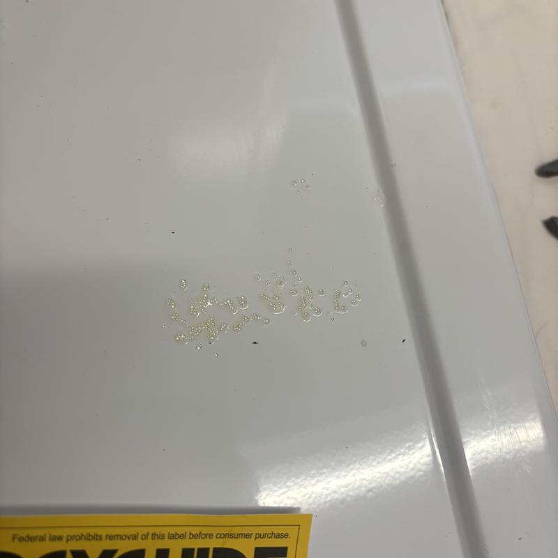 Water softener beads on appliance surface in home