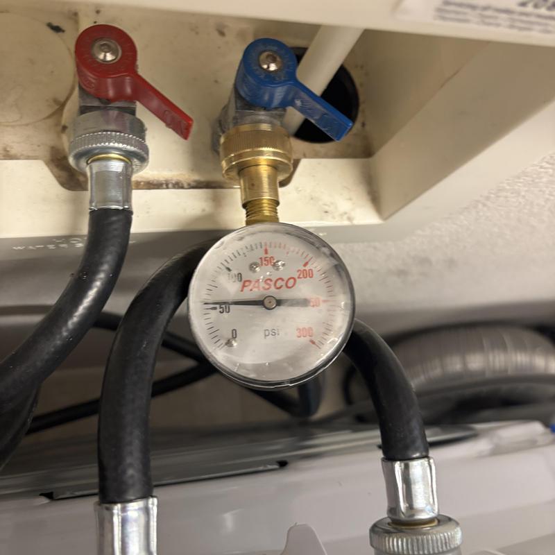 Water softener pressure gauge with red and blue valves
