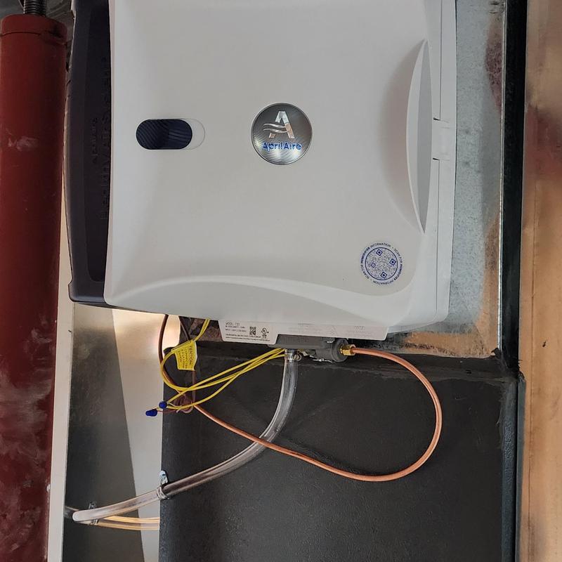 Aprilaire humidifier installed with wiring and tubing