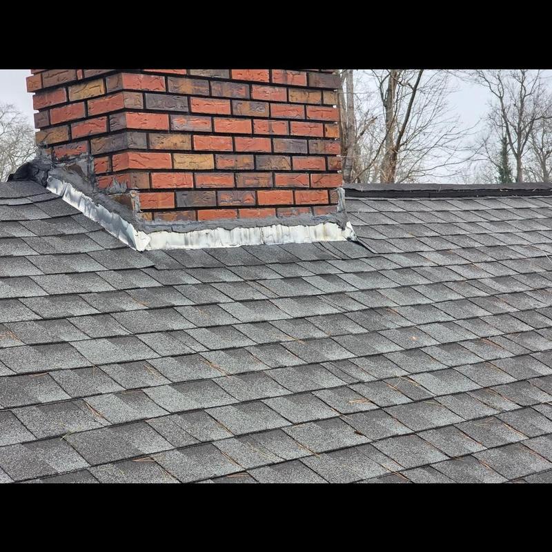 Owens Corning shingle roof with brick chimney flashing