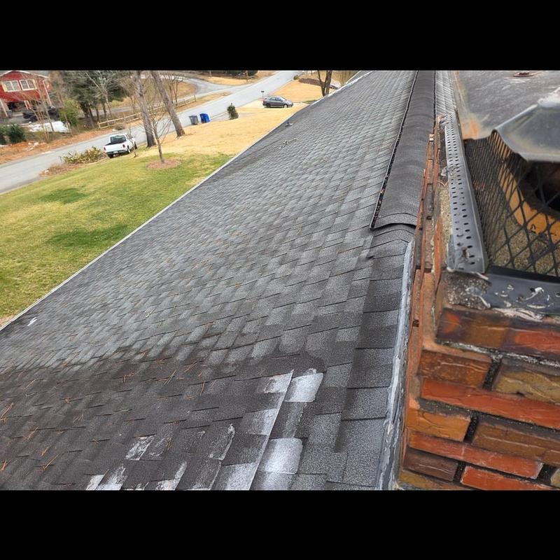 Architectural shingle roof with chimney flashing inspection