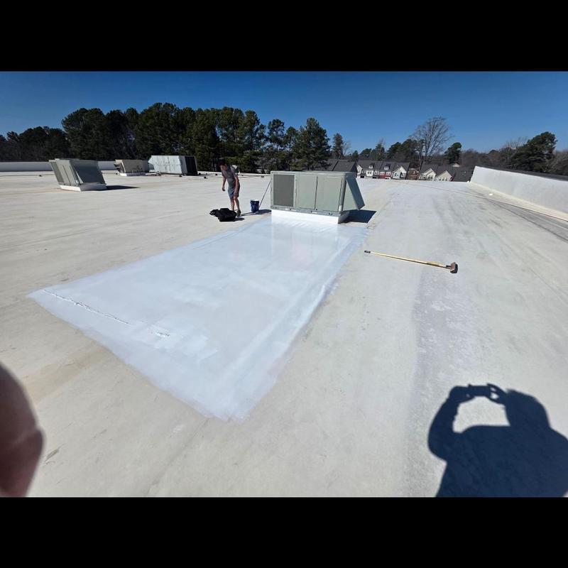 TPO roof silicone coating application near HVAC units