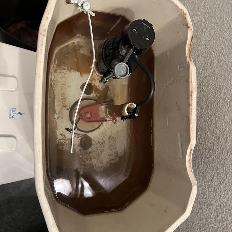 Toilet fill valve inside tank with water level