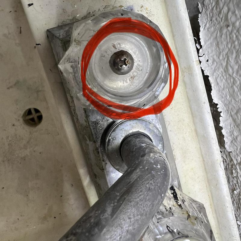 Shower faucet handle with red circle marking