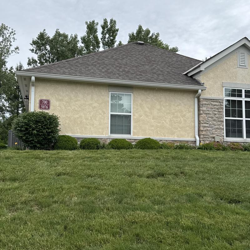 Roof shingles and gutters on condo exterior in Ohio Roof shingles and gutters on condo exterior in Ohio