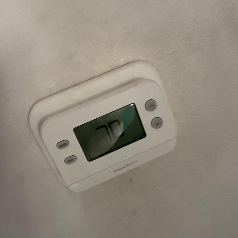 Thermostat display showing set temperature at 70°F Thermostat display showing set temperature at 70°F