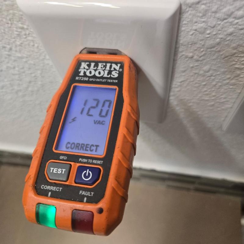 Electrical outlet tester showing 120 VAC and correct wiring